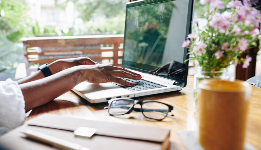 Woman working from home on laptop 870x500px