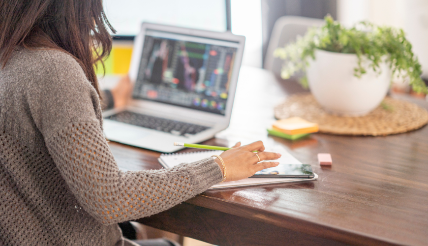 Woman working from home at laptop 870x500px